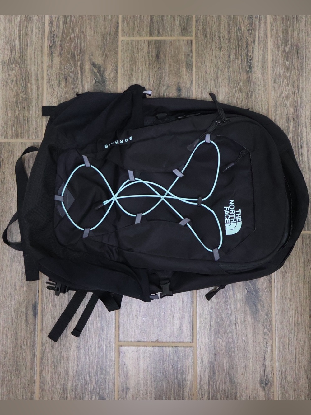 The North Face Black Backpack with Light Blue Bungee Cord